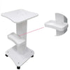 A white portable beauty trolley cart with a slanted tray and a separate seat.