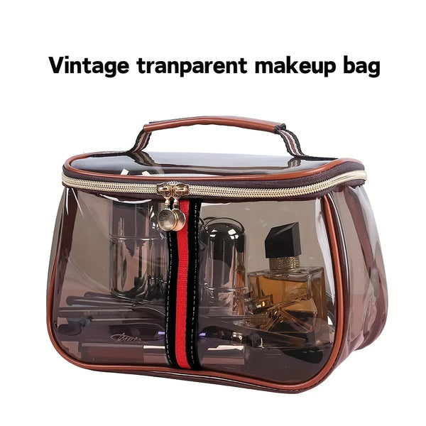 A vintage transparent makeup bag with a brown leather trim and a gold zipper, containing various cosmetic items.