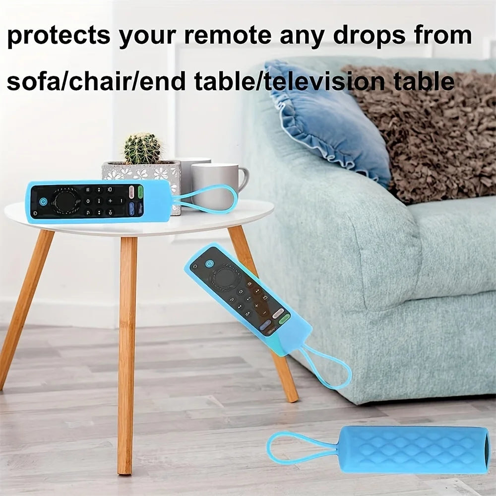 Una funda de silicona azul protege un control remoto de Fire Stick de caídas sobre una mesa.