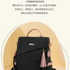 A black women's anti-theft PU leather travel backpack with pink accents shown from the front.