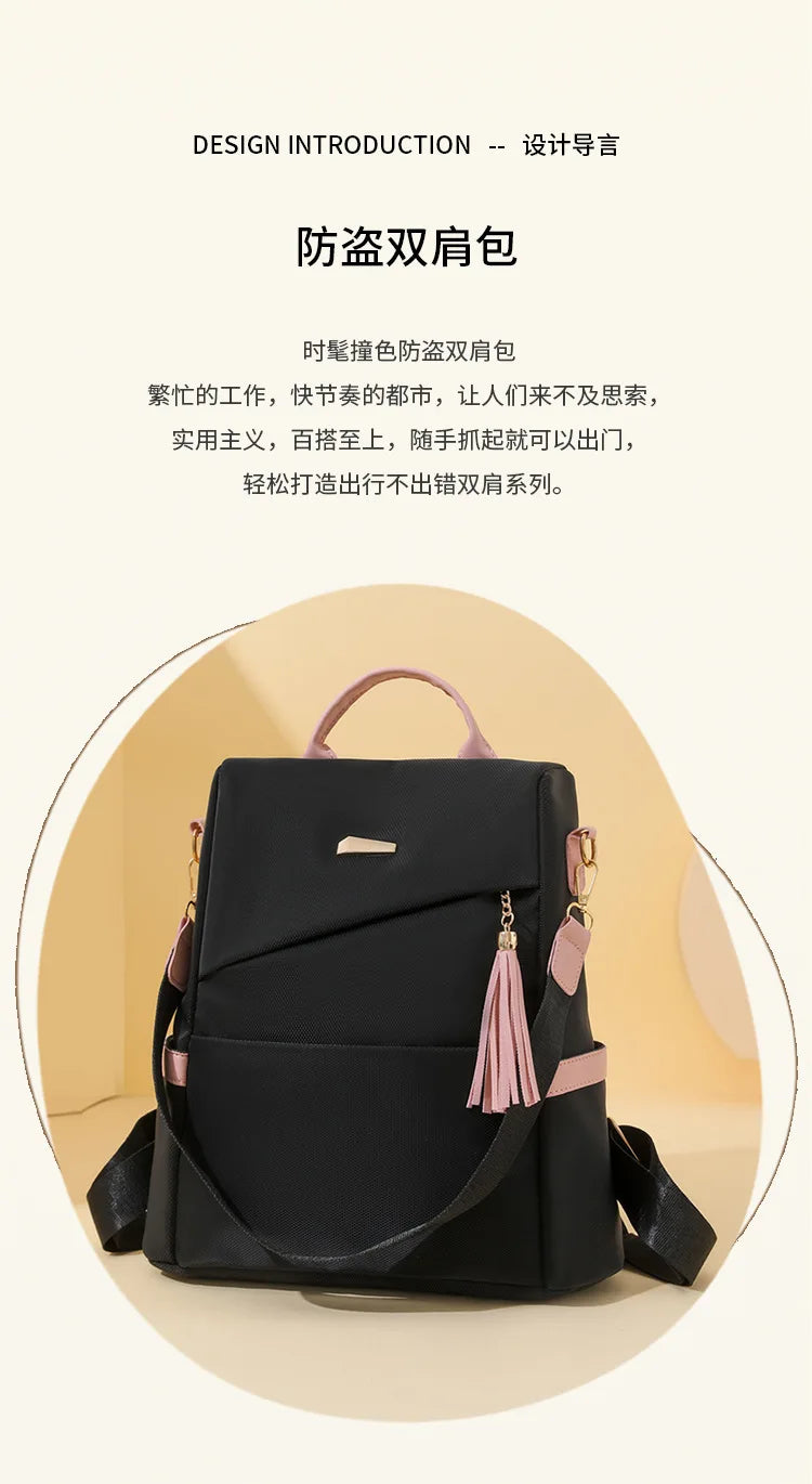 A black women's anti-theft PU leather travel backpack with pink accents shown from the front.