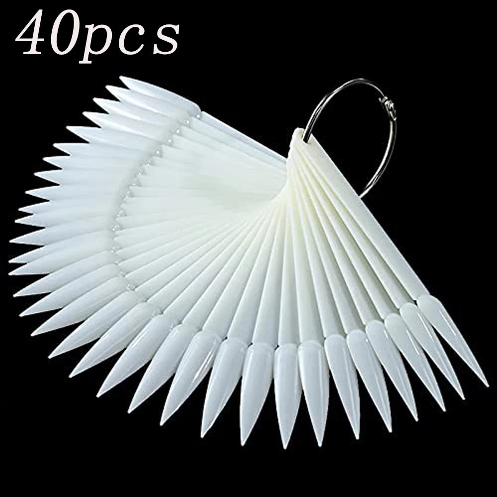 A set of 40 false nail tips in a fan shape, white and translucent, with a metal loop for attachment.