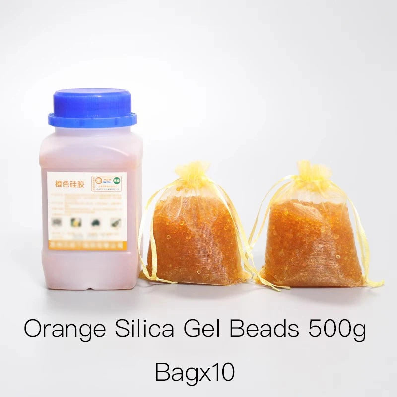 A bottle of orange silica gel beads next to ten sealed bags of the same product.