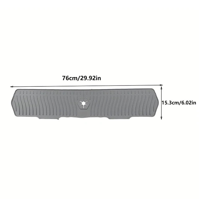 A gray silicone kitchen sink drain mat shown flat with dimensions 76cm/29.92in and 15.3cm/6.02in.