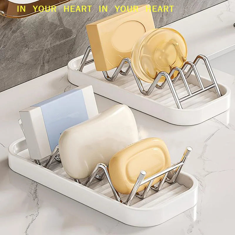 A white stainless steel rack holds four yellow and cream-colored W-shaped soap containers.