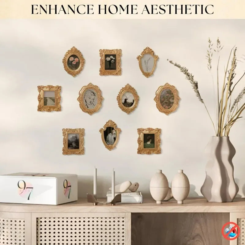 A gallery wall display of vintage style decorative photo frames on a light wall.