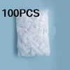 A white plastic bag filled with 100 disposable transparent shower caps.