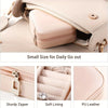A light pink portable PU leather jewelry storage box with a zipper and soft lining shown open.