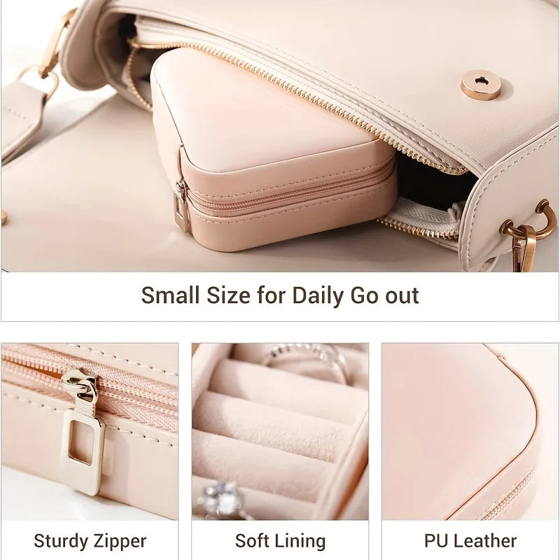 A light pink portable PU leather jewelry storage box with a zipper and soft lining shown open.