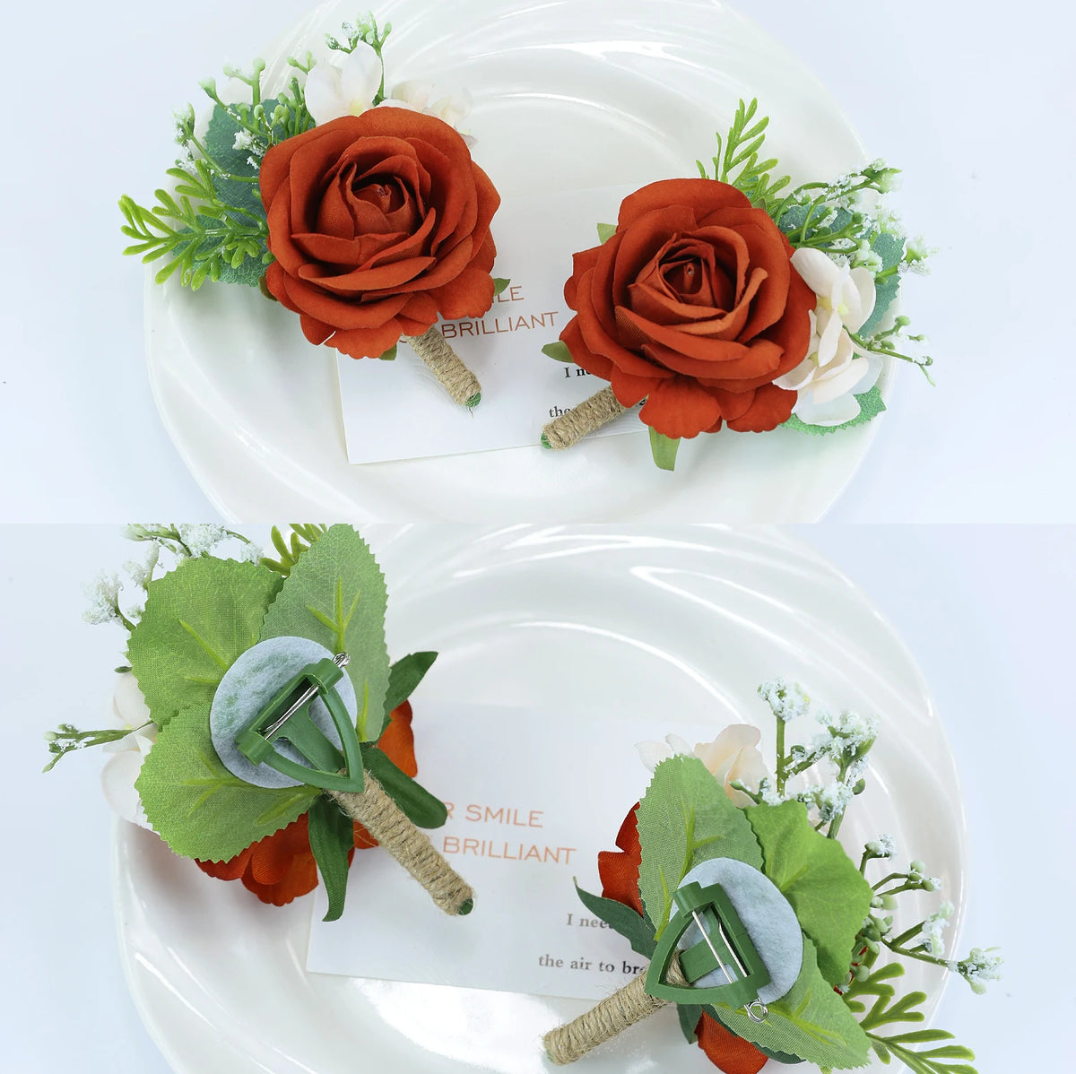 Boutonnière vintage orange soie avec feuillage vert et fleurs blanches sur une assiette blanche.