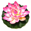 A vibrant pink artificial lotus flower blooming on a green leaf.