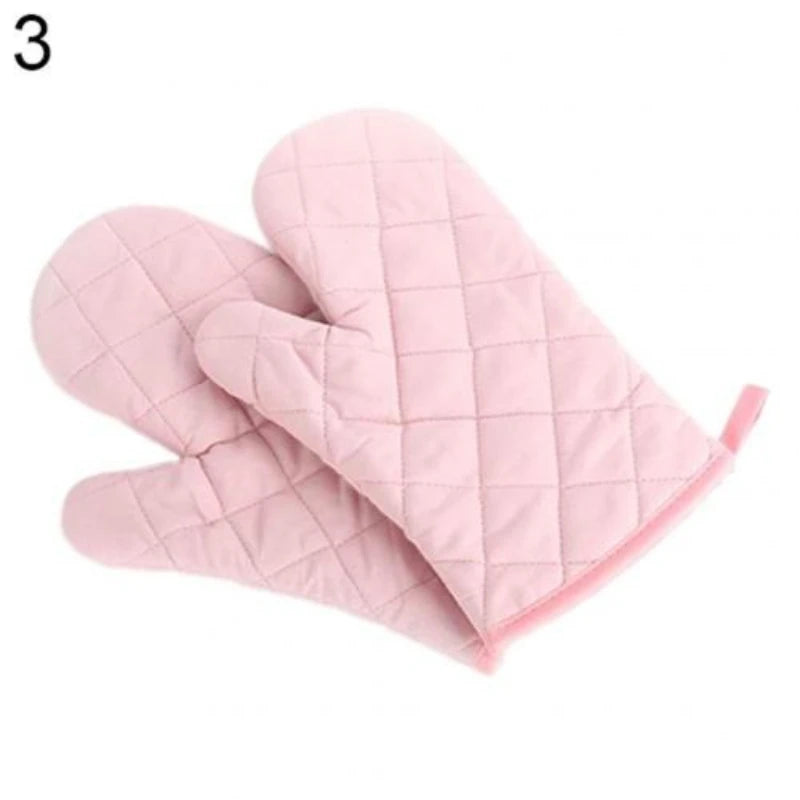 A pink quilted heat resistant oven mitt is shown folded, ready for kitchen cooking.