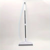 A long, slender white and silver ergonomic broom and scraper set against a plain white background.