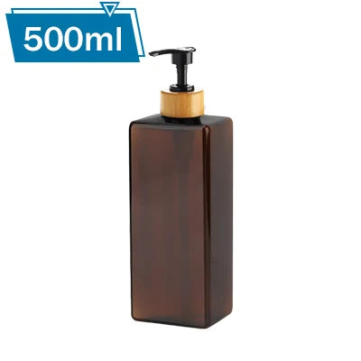 A dark brown refillable pump bottle with a wooden cap and a black pump dispenser, labeled for 500ml.