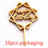 A gold-colored acrylic birthday cake topper shaped like a menorah with the words Happy Birthday on it, shown against a white 