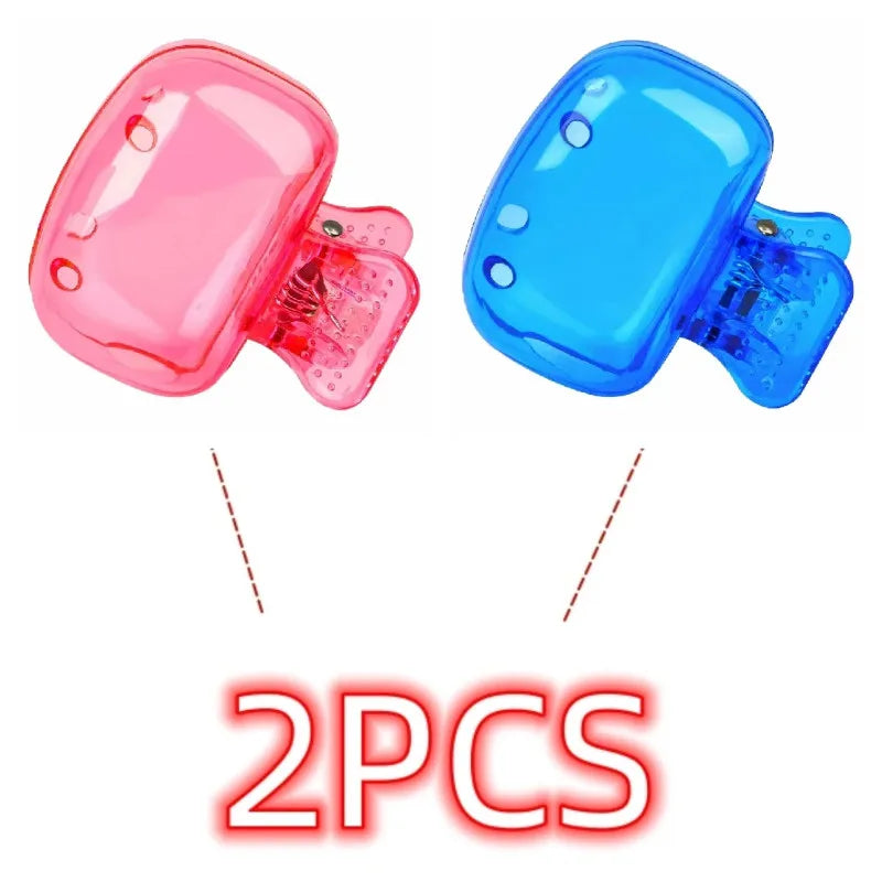 Two reusable silicone brush head covers, one pink and one blue, shown from the side.