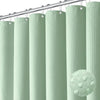 A collection of light green, textured shower curtains hanging from a metal rod.