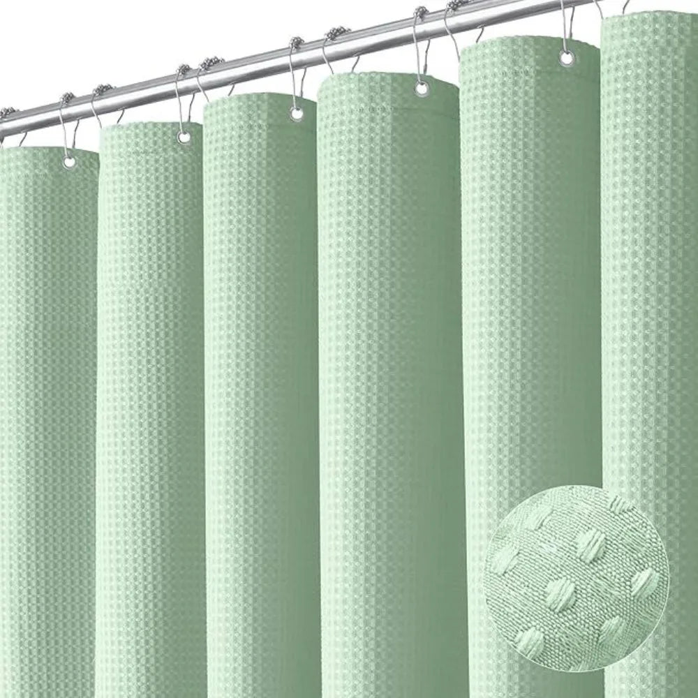 A collection of light green, textured shower curtains hanging from a metal rod.