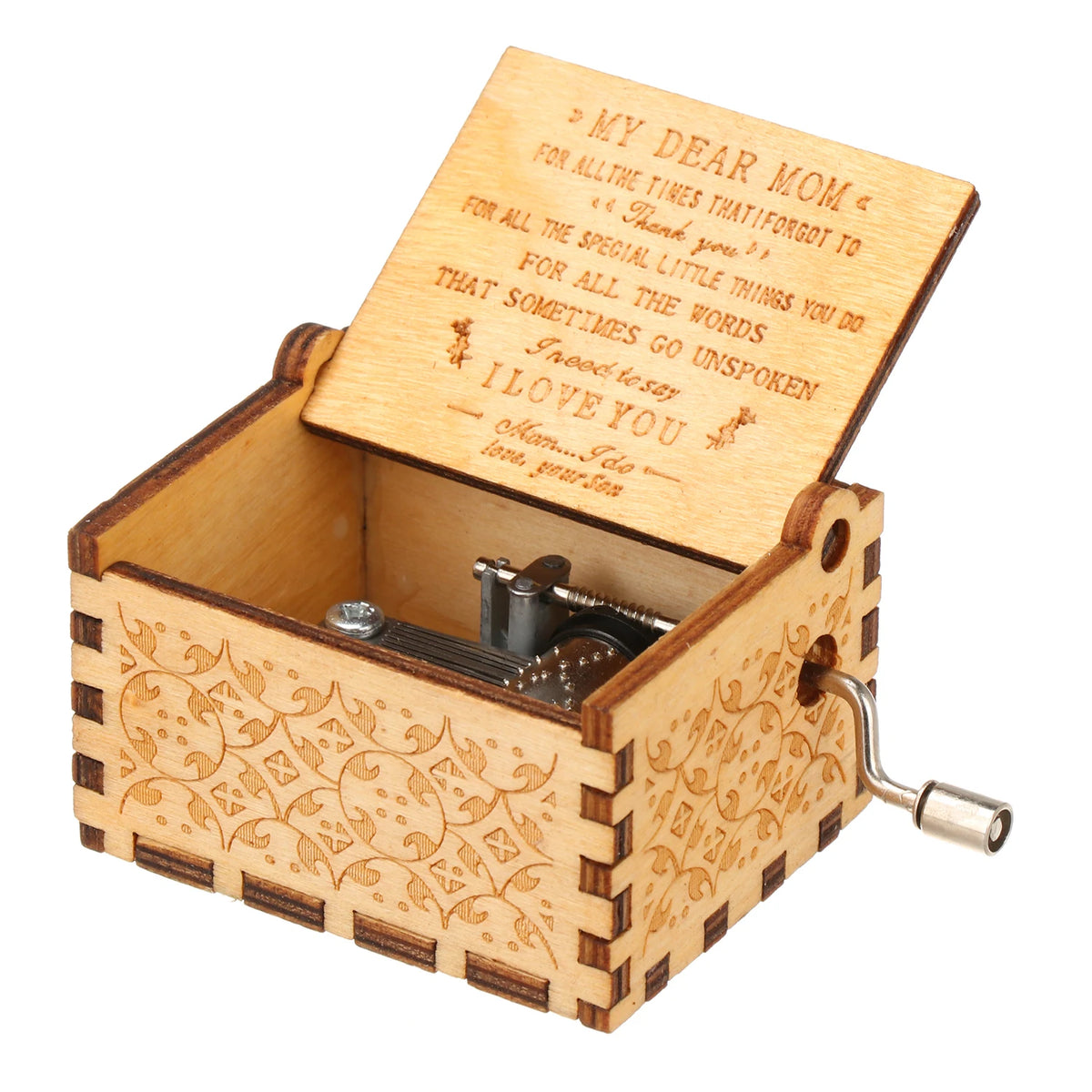 A vintage engraved wooden music box with a lid open, showing an inscription inside.