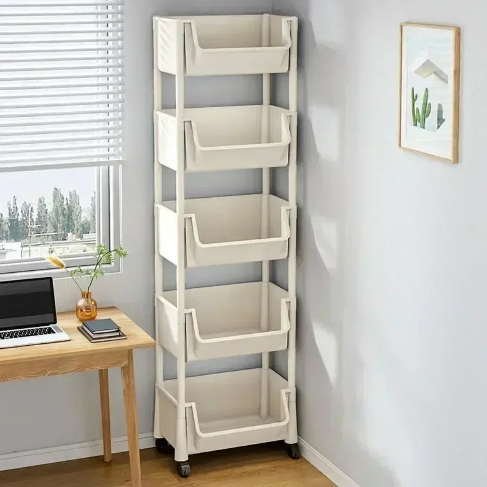 A tall, white multi-tier rolling storage rack with open compartments is shown next to a window and a wooden desk.