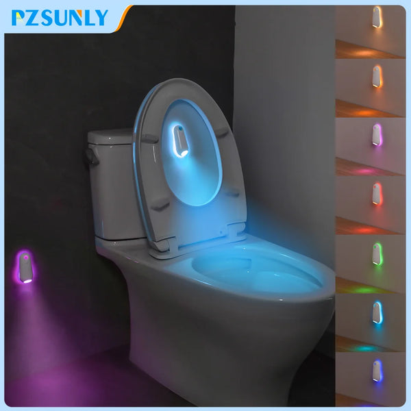 A modern toilet with a built-in blue light and a separate purple accent light, illuminated in a dark bathroom setting.