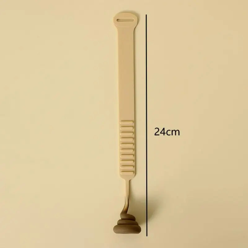 A beige portable toilet lid lifter tool with a long handle and a curved end.