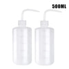 A pair of clear 500ml squeeze bottles with measurement lines for tattoo solutions