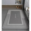 A gray anti-slip floor mat is displayed in a modern bathroom setting with storage shelves above.