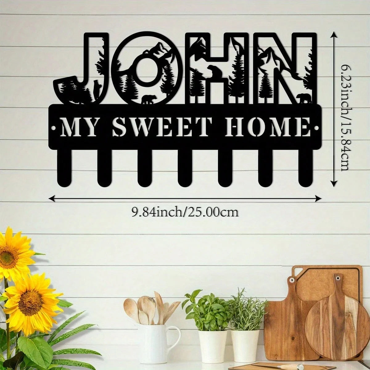 Black silhouette wall sign featuring the name John and the phrase My Sweet Home with a rustic metal hook design