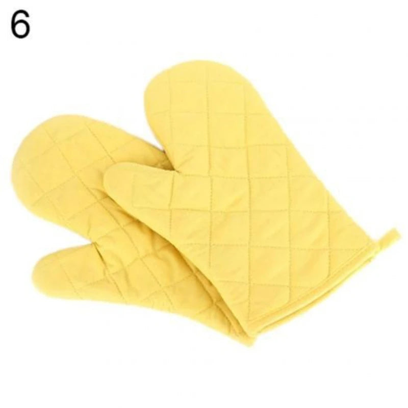 Yellow quilted heat resistant oven mitts shown from the side.