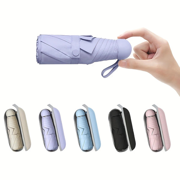 A hand holds a purple mini travel umbrella, showing various color options.