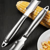 A stainless steel corn kernel remover peeler is shown against a dark background with corn kernels nearby.