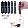 A set of five black portable refillable perfume spray bottles with gold accents, shown next to a glass perfume bottle.