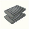 A stack of gray silicone soap dishes with anti-slip bases.