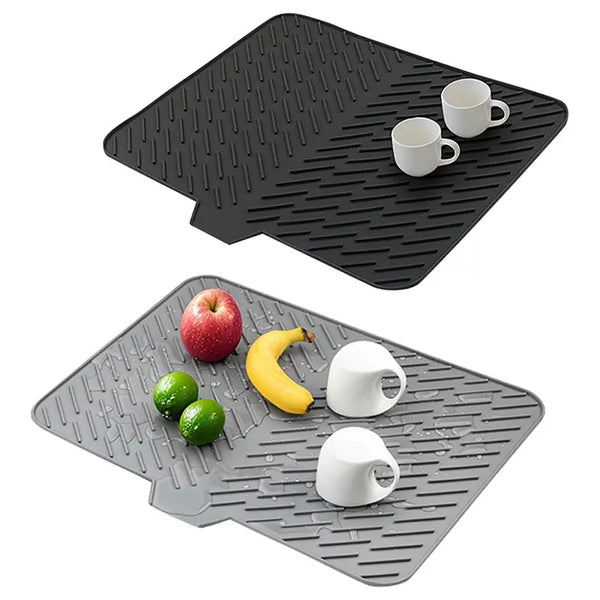 Black silicone dish drying mat with a built-in drain lip and two white mugs