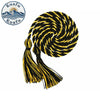 A graduation honor cord with black and gold stripes and tassel ends, coiled into a spiral.