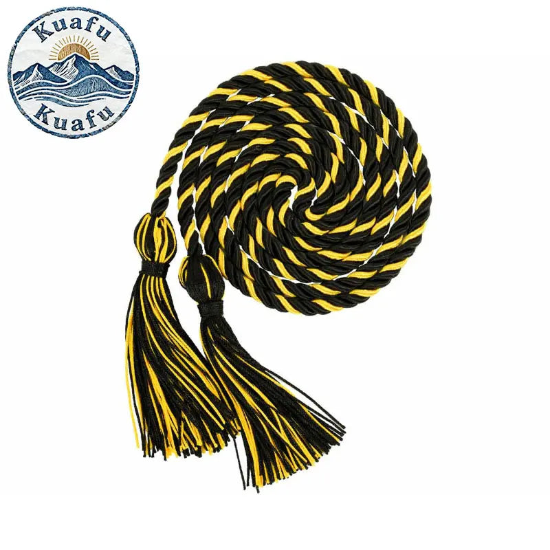 A graduation honor cord with black and gold stripes and tassel ends, coiled into a spiral.