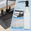 A black faucet mounted on a sink shows a white liquid soap dispenser with a black pump head and food grade plastic material.