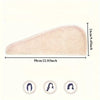 A beige microfiber hair drying wrap towel shown from the side with dimensions 58cm long and 24cm high.