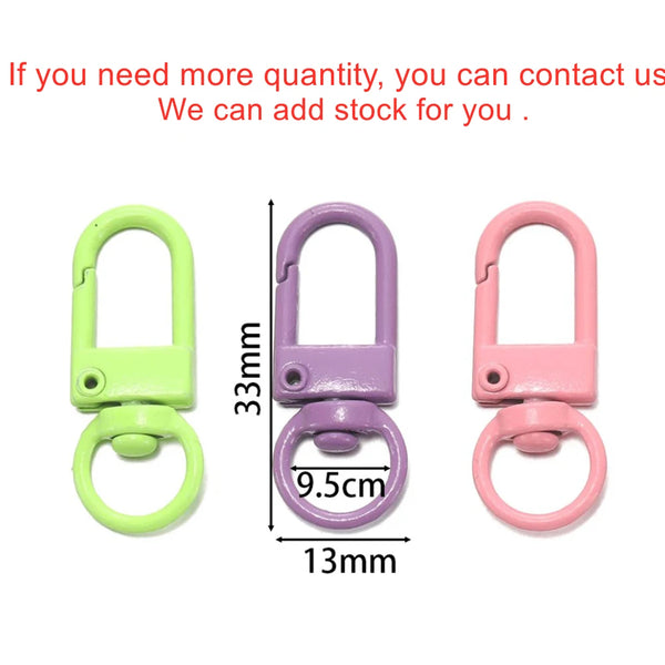Three colorful alloy snap lobster clasp hooks in lime green, purple, and pink with various sizes