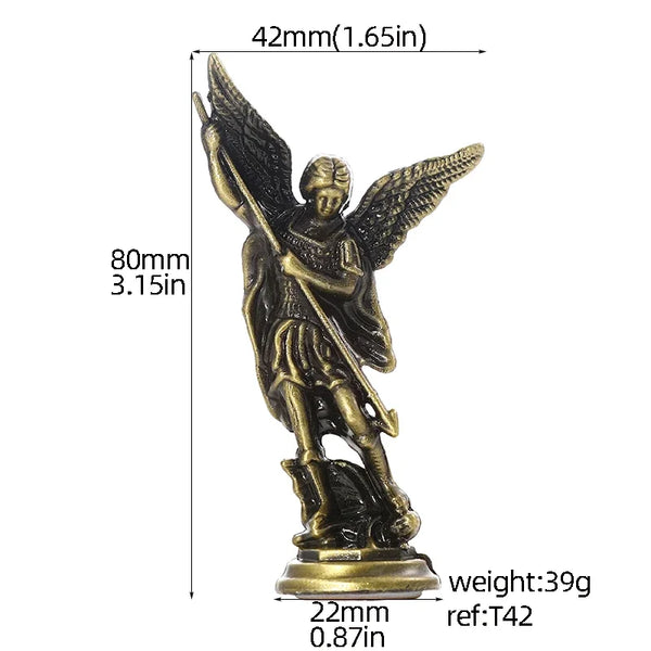 A bronze figurine of the Saint Michael Archangel standing on a base.