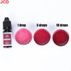 A bottle of JCD liquid candle dye with dropper and several discs showing different concentrations of burgundy color.