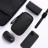 A black portable multi-use storage organizer pouch, a smartphone case, and a black smartwatch are displayed on a white backgr