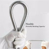 A hand is holding a flexible stainless steel shower hose, demonstrating its powerful bending capacity.