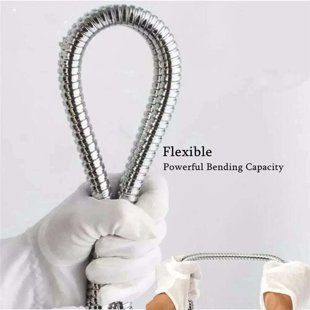 A hand is holding a flexible stainless steel shower hose, demonstrating its powerful bending capacity.