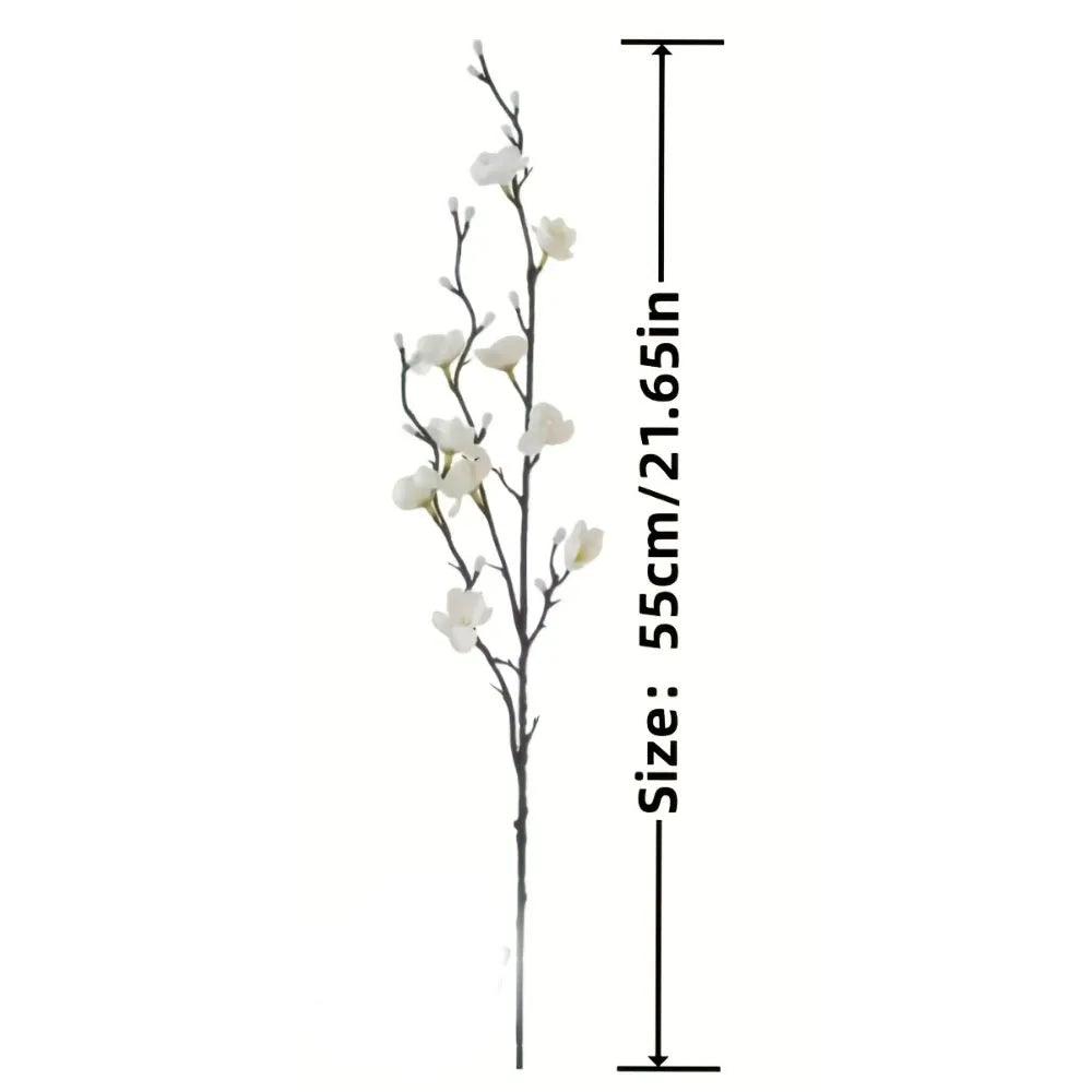 A vertical arrangement of white artificial plum blossoms on a dark stem.