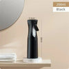 A black multi-functional handheld spray bottle is displayed on a shelf next to a mirror.
