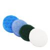 A set of four electric cleaning brush heads including a blue foam pad, a purple scouring pad, a green sponge, and a white pol