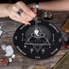 A hand holds a crystal necklace over a wooden divination altar set featuring geometric symbols and crystals on a rustic woode