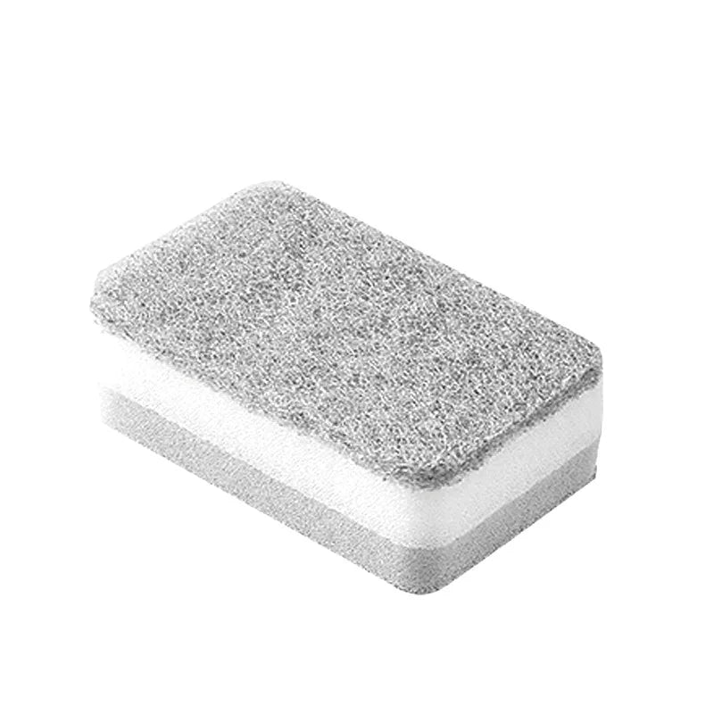A rectangular cleaning sponge with a textured gray top and white sides.